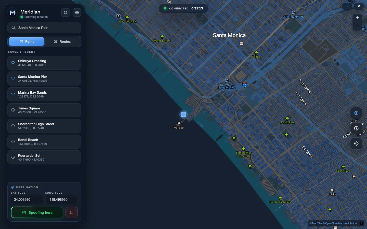 The Meridian One app on Windows: an iPhone 15 Pro connected and spoofing its location to Santa Monica Pier, with saved and recent places in the sidebar